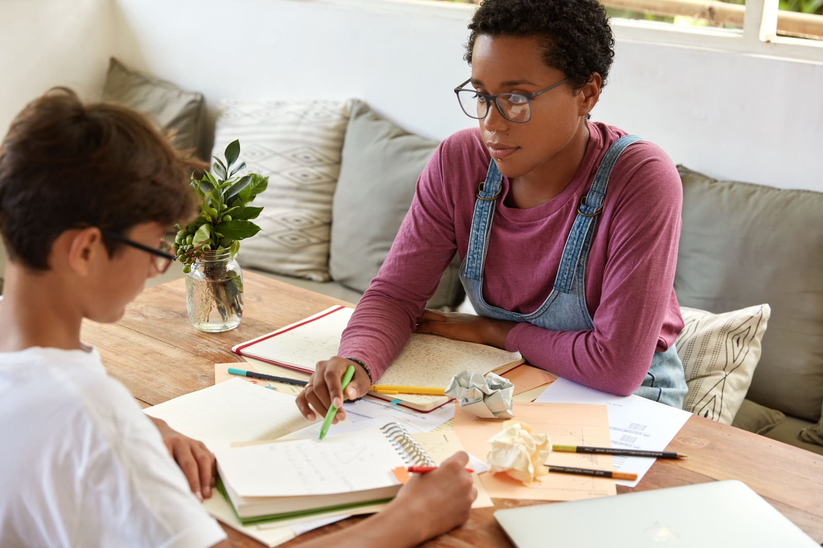 A school counselor meeting with a student in a guidance office