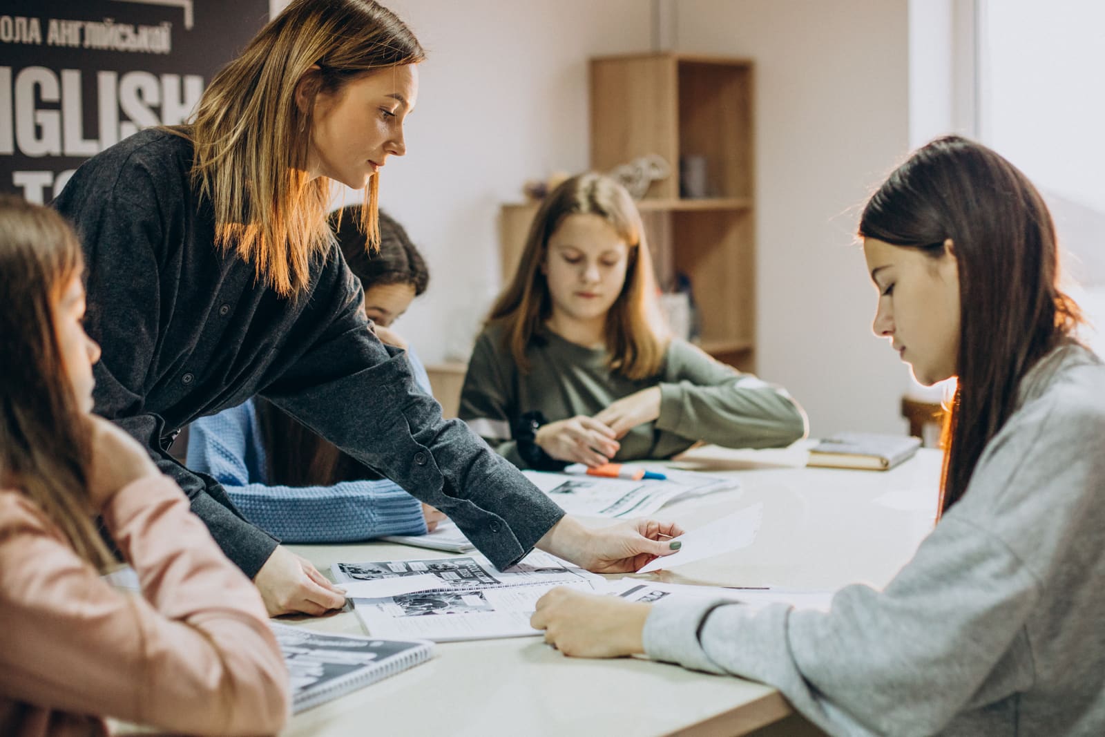 A secondary school teacher instructing teenage students in a high school classroom