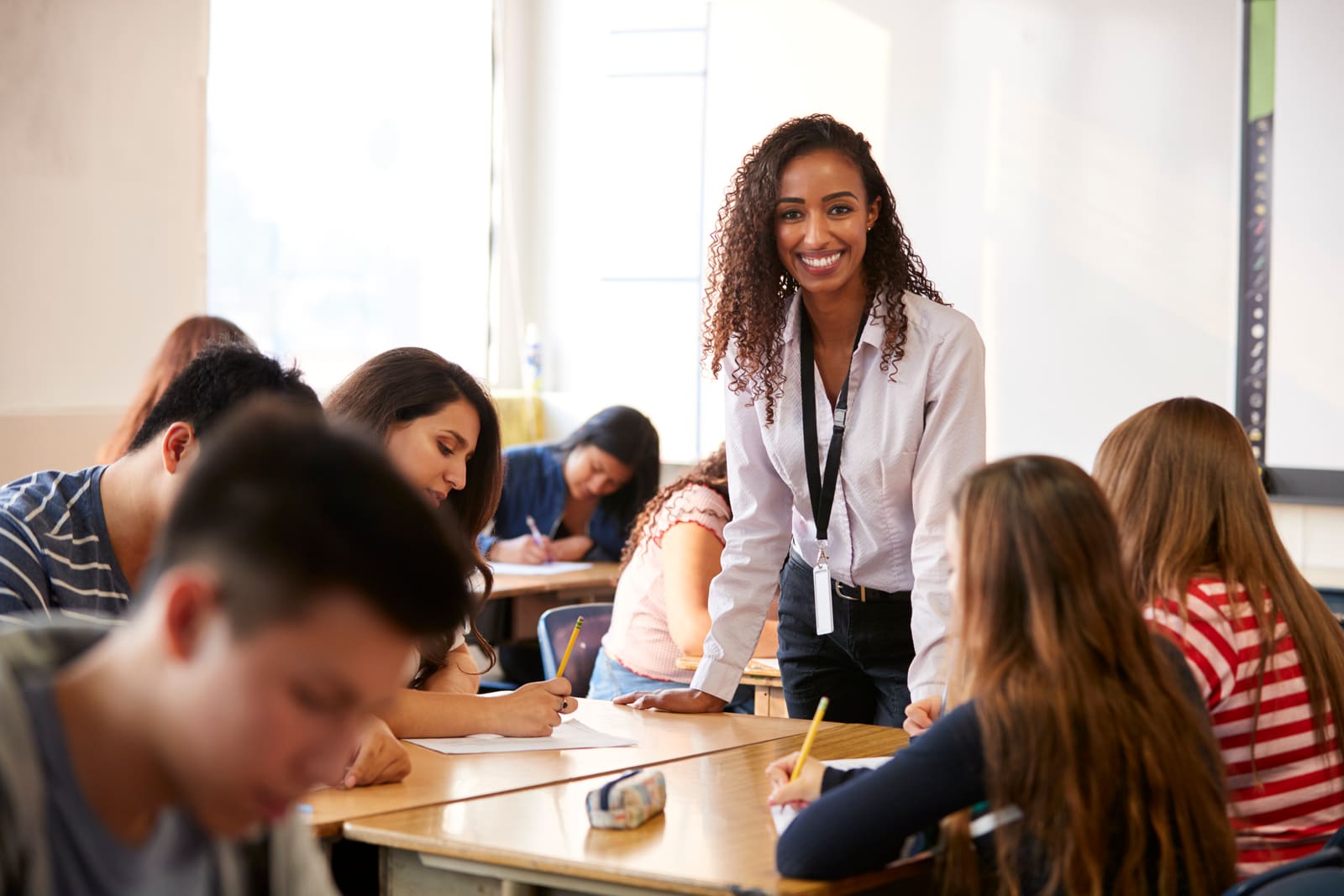 A secondary school teacher instructing teenage students in a high school classroom
