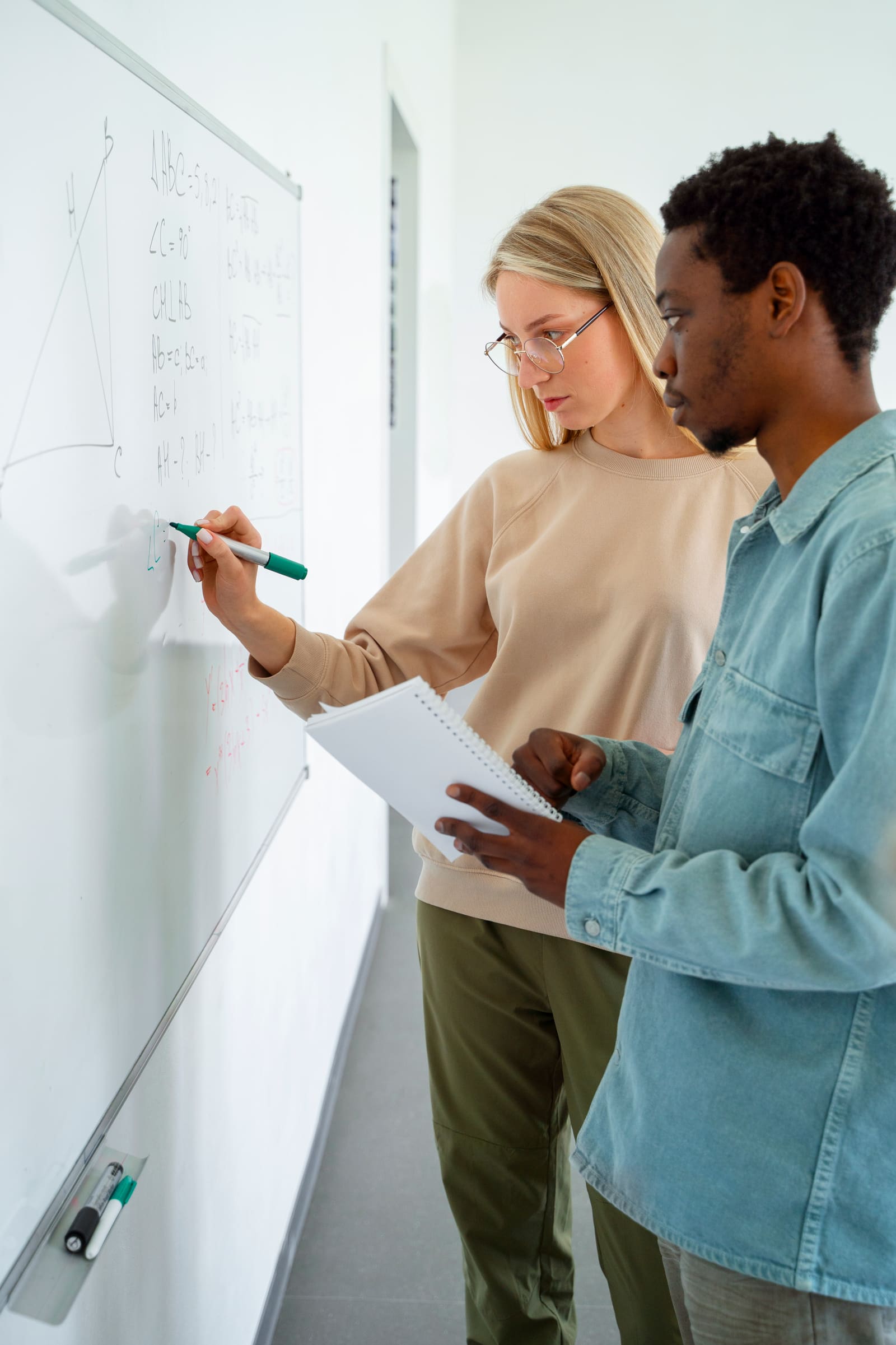 A secondary school teacher instructing teenage students in a high school classroom