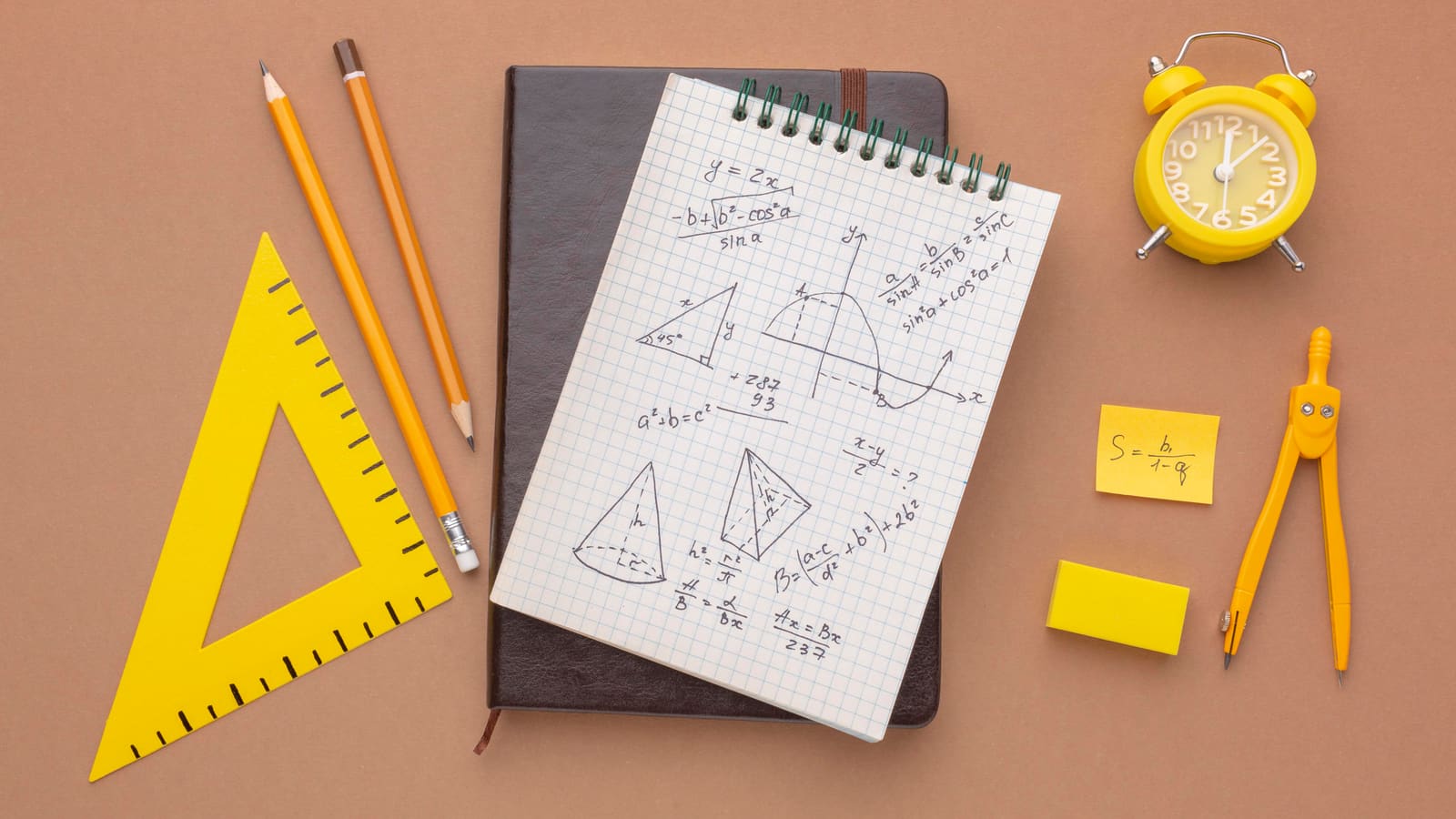 A mathematics teacher working through an equation on the whiteboard with students