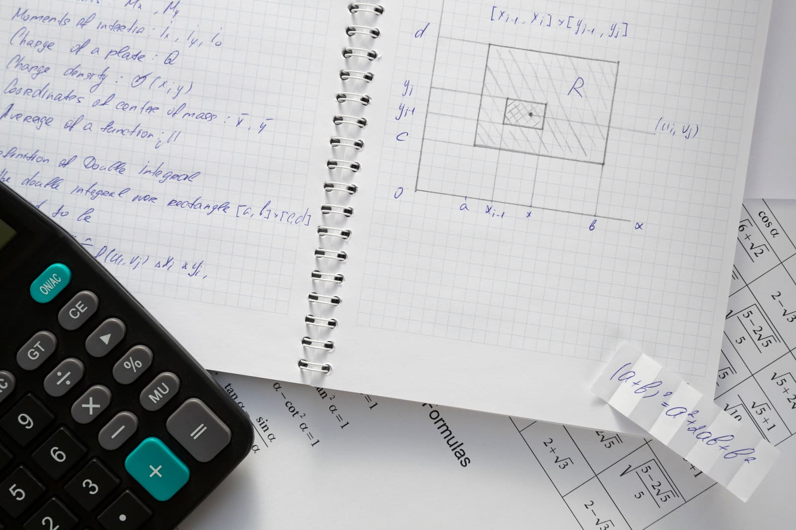 A mathematics teacher working through an equation on the whiteboard with students